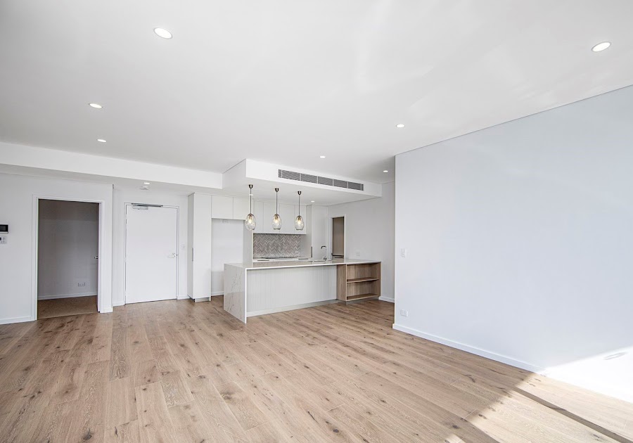 Open-plan apartment living area freshly painted by Performance Painting